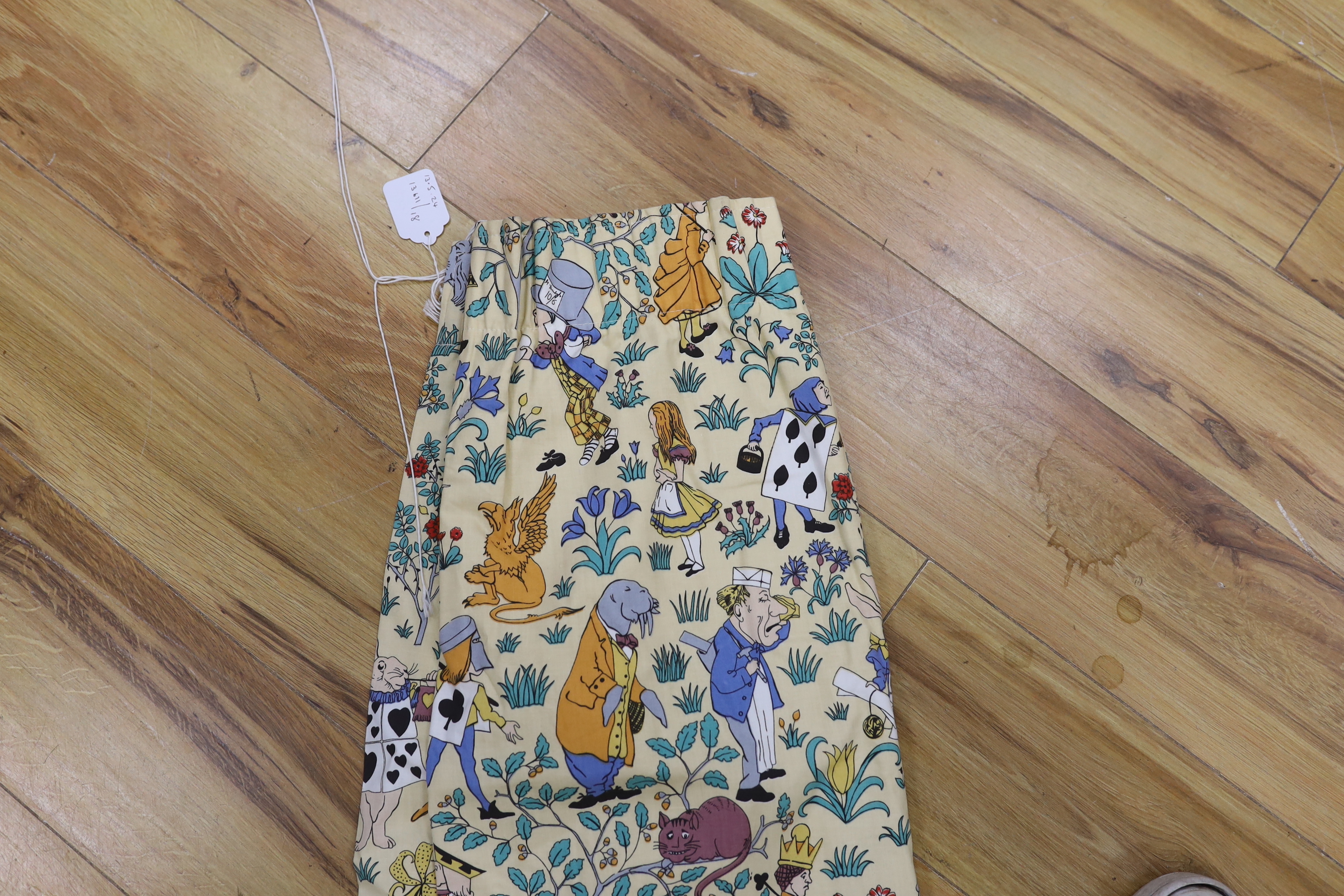 A late 1980’s vintage curtain of Alice in Wonderland, design originally by C. F. A. Voysey; selvage printed; The Habitat V&A collection, 130cm wide at the bottom, 130cm long